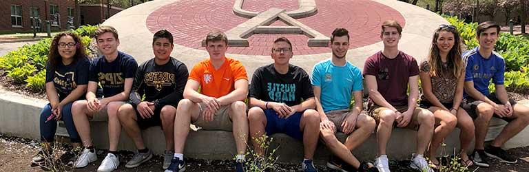 Transfer students outside of the Honors Complex on The University of Akron campus